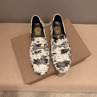 Versace Chain Reaction distressed black-and-white loafers