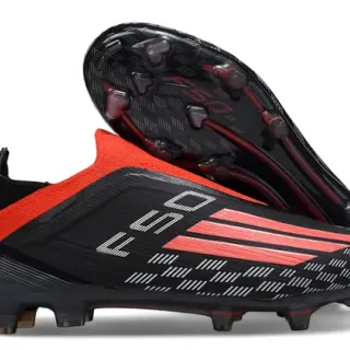Adidas Chaussures de football noir rouge coupe basse col de chaussette texturé matériau synthétique supérieur sol ferme