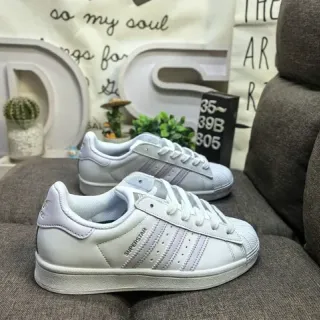 أديداس سوبرستار حذاء أبيض وأرجواني جلدي علوي نمط حياة Shell-Toe