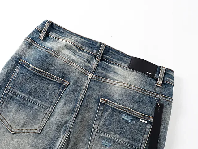 Amiri Jeans Bleu et Blanc Distressed avec Impression Graphique 5