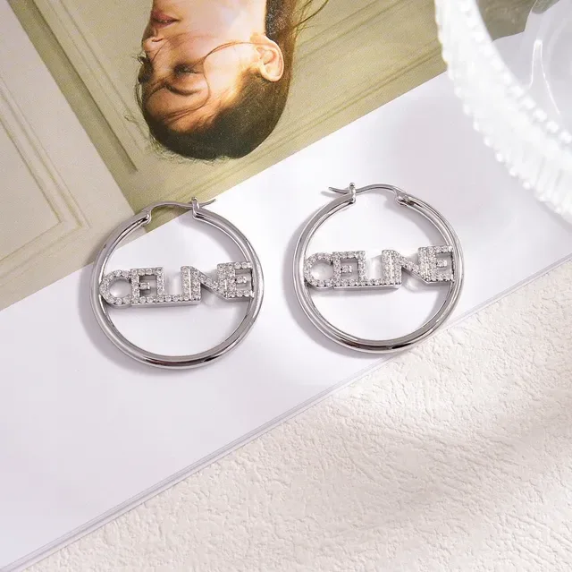 Boucles d'oreilles Celine Logo Hoop Argent et Or Cristal-embellished 3