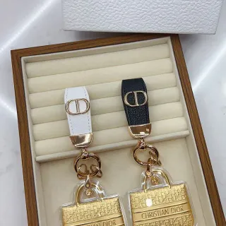 Dior Mini Bag Charm गोल्ड व्हाइट मिनिएचर ट्रांसपेरेंट एक्रिलिक केसिंग हैंडबैग
