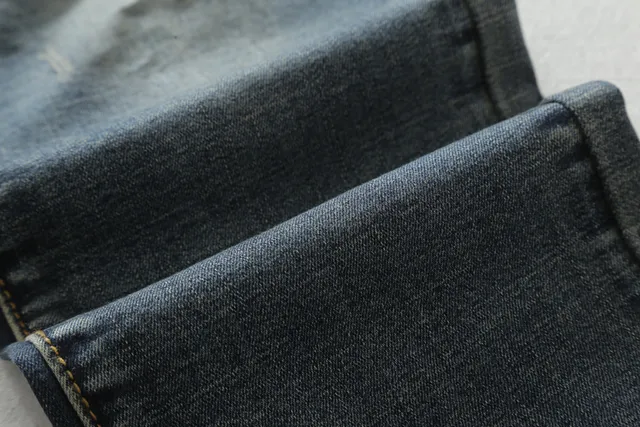 Jeans distressed moto-panelled zippé tapered 7
