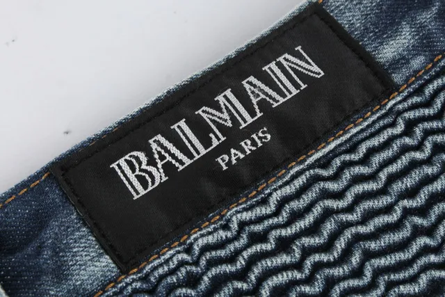 Jeans desgastados reforzados en las rodillas con bolsillo de cremallera y bajo en bruto 2