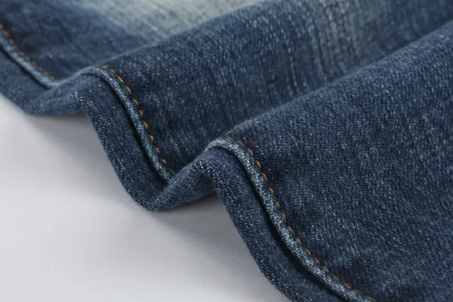 Jeans desgastados reforzados en las rodillas con bolsillo de cremallera y bajo en bruto 3