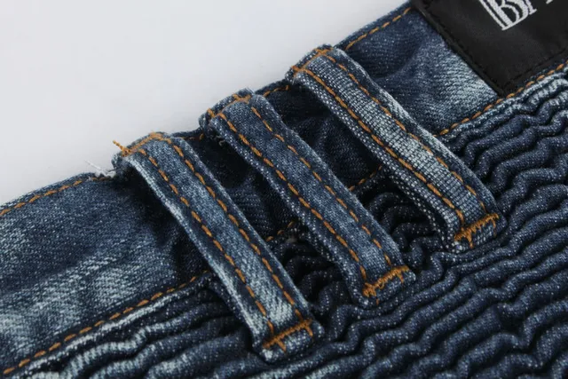 Jeans desgastados reforzados en las rodillas con bolsillo de cremallera y bajo en bruto 11