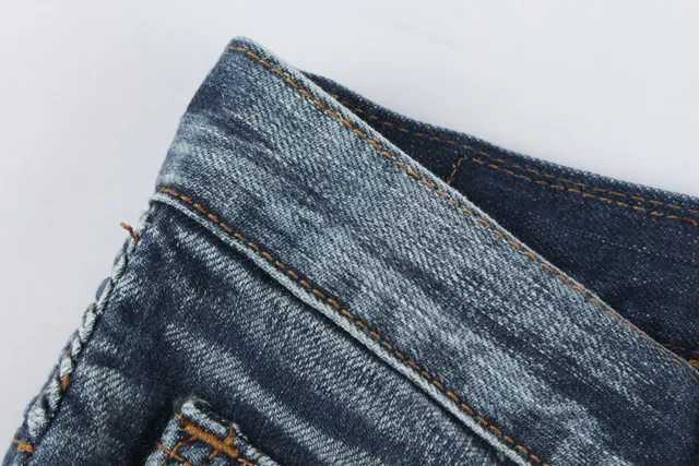 Jeans desgastados reforzados en las rodillas con bolsillo de cremallera y bajo en bruto 13