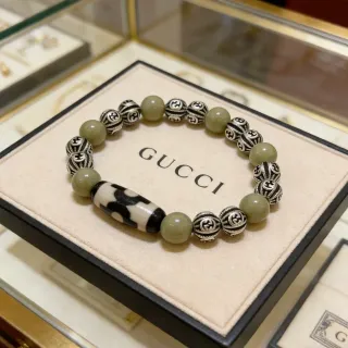 سوار Gucci خرز أخضر زيتوني وإيغال فضي