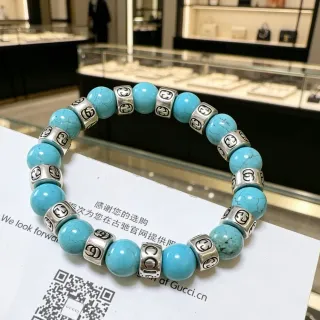 Gucci GG Marmont فيريت ولون فضي مرصع خرز سوار مطاطر