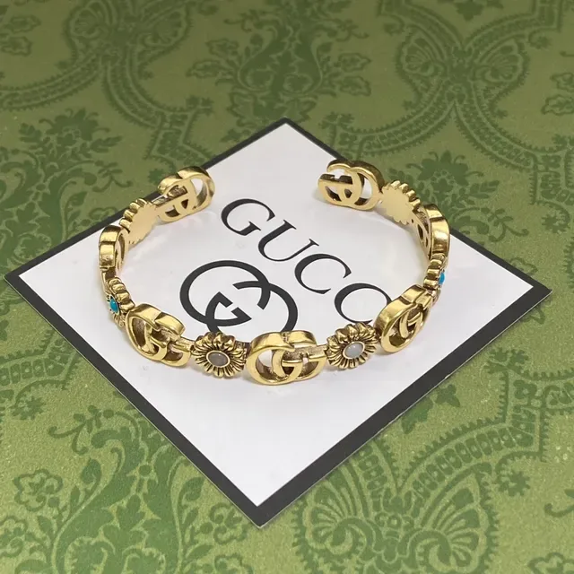 Bracelet Gucci Interlocking G et Motif Floral en ton doré 4