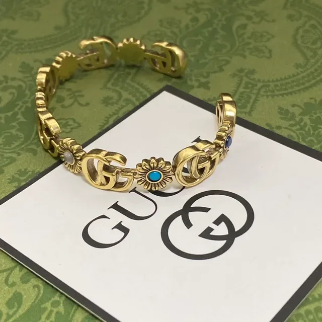 Bracelet Gucci Interlocking G et Motif Floral en ton doré 5