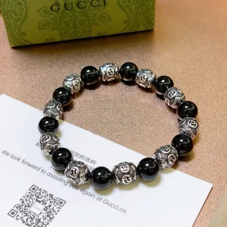 سوار Gucci Interlocking G أسود فضي موتيف خرز