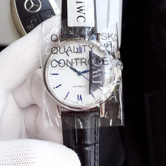 IWC Portugieser آلي وجه أبيض جلد أسود ساعة ميكانيكية 9