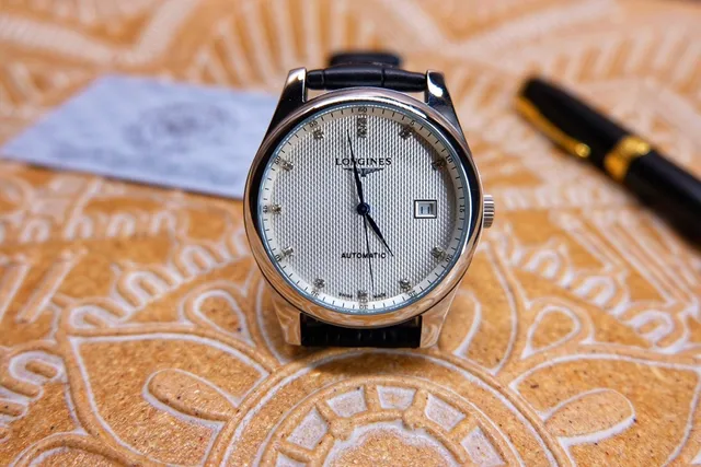 Longines काला चांदी स्टेनलेस स्टील केस सफेद गिलोशे डायल यांत्रिक घड़ी 8