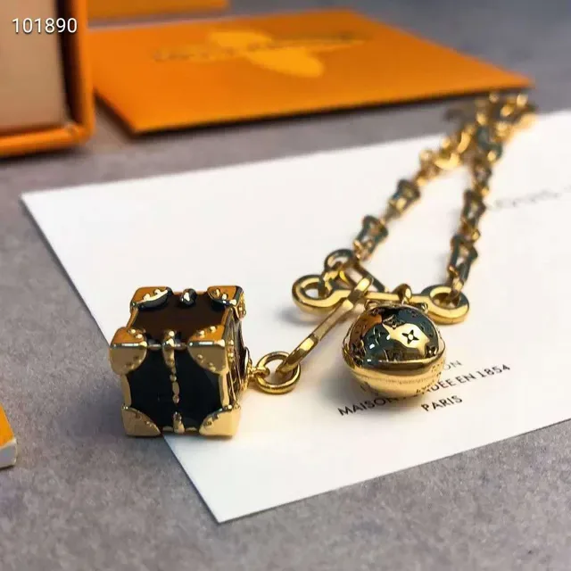 Bracelet Louis Vuitton Lockme Chaîne à maillons Or Noir LV Monogram Cadenas Charme 7