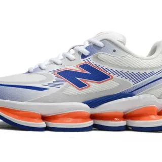 New Balance 9060 सफेद नीला सेगमेंटेड ऑरेंज मिडसोल पॉड्स मेश और सिंथेटिक ओवरले अपर चंकी स्नीकर