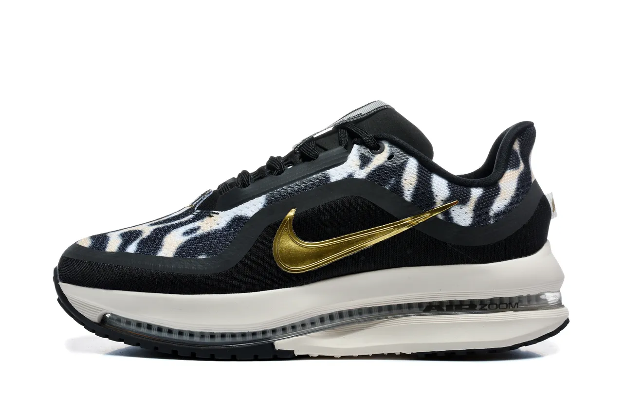 Zapatillas de running Nike negro y dorado con estampado de cebra en la parte superior de tela y Swoosh metálico 2