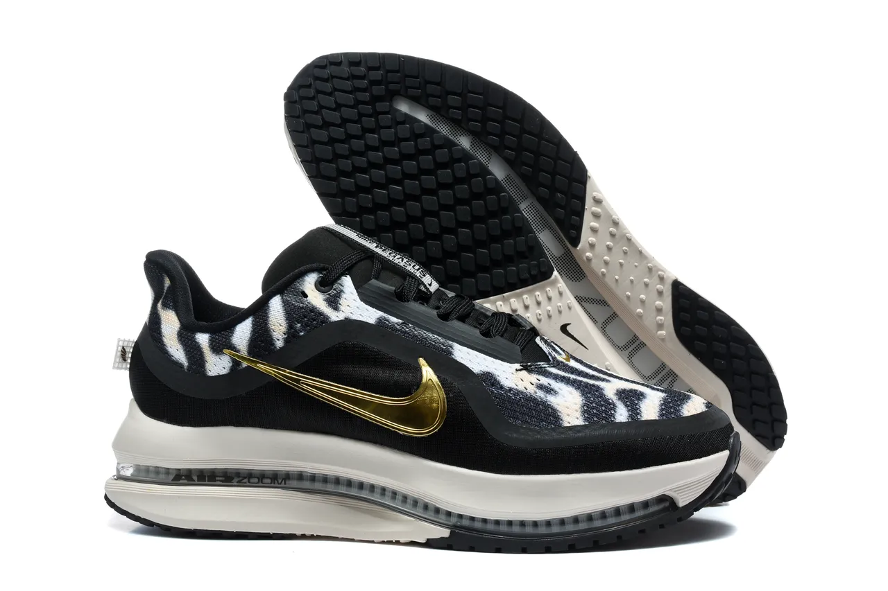 Zapatillas de running Nike negro y dorado con estampado de cebra en la parte superior de tela y Swoosh metálico 5