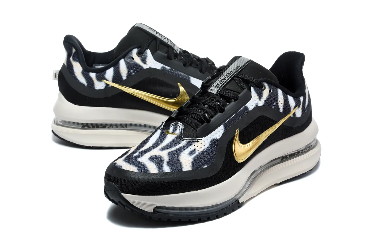 Zapatillas de running Nike negro y dorado con estampado de cebra en la parte superior de tela y Swoosh metálico 6