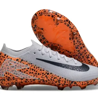 Nike Mercurial Vapor Sapatos de futebol laranja preto com upper de malha e padrão salpicado para terreno firme
