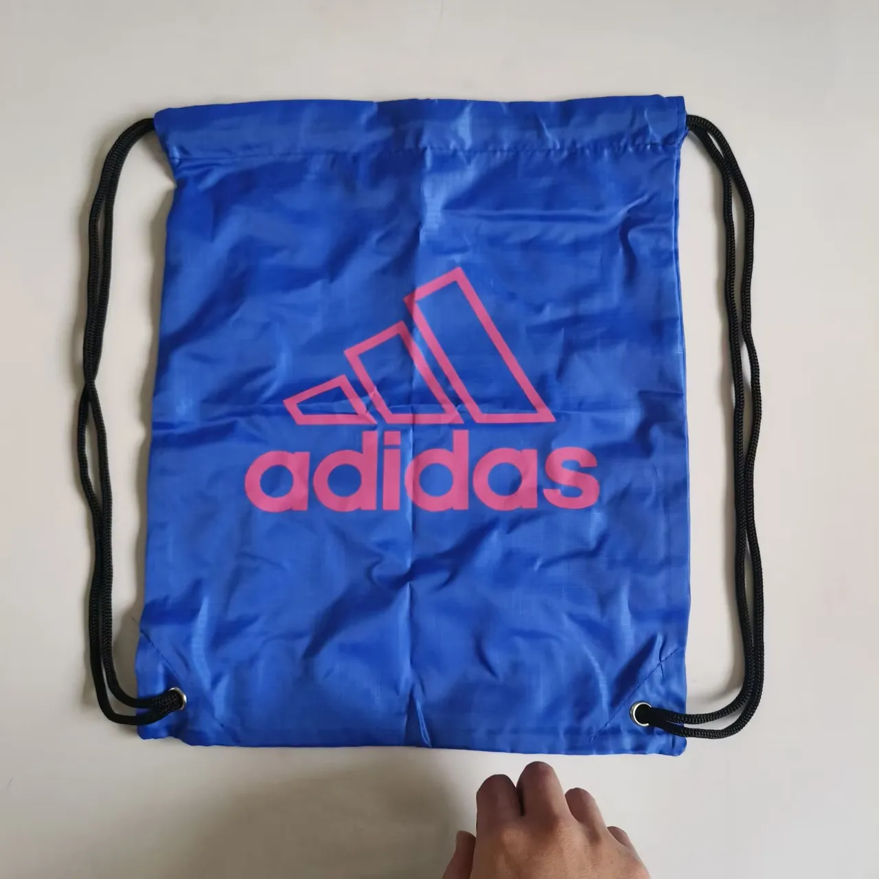 Nike नारंगी काली ड्रॉस्ट्रिंग बंद सैक-स्टाइल सिल्हूट बकेट बैग 15