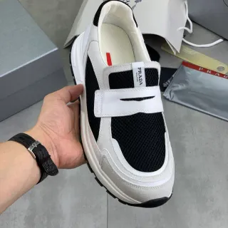 Prada Cloudbust काले और सफेद मेश स्लिप-ऑन लाइफस्टाइल स्नीकर