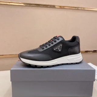 Prada Cloudbust काले मेश और चमड़े की लाइफस्टाइल स्नीकर