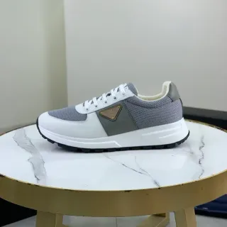 Prada White Gray Mesh And Leather Paneling Triangular Metal Logo Plaque Chunky Sneakers