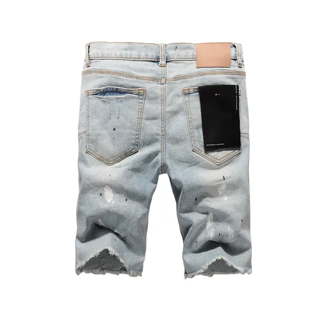Purple Brand shorts de denim distressed con salpicaduras de pintura y lavado ligero 14