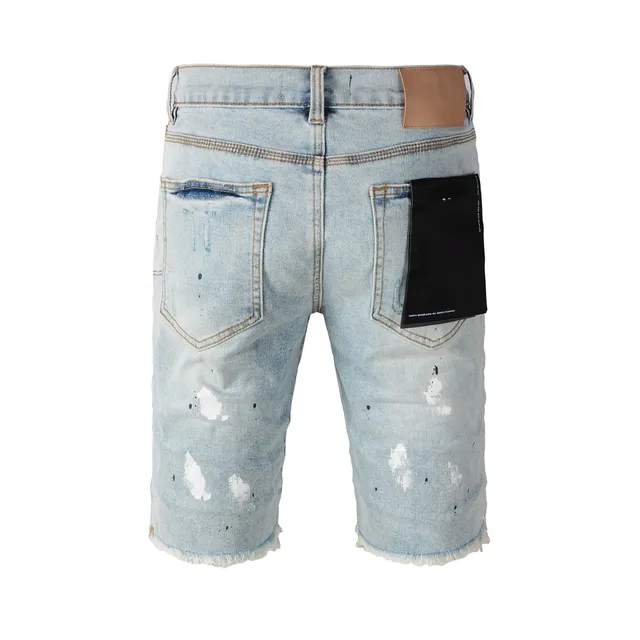 Purple Brand shorts de denim distressed con salpicaduras de pintura y lavado ligero 20