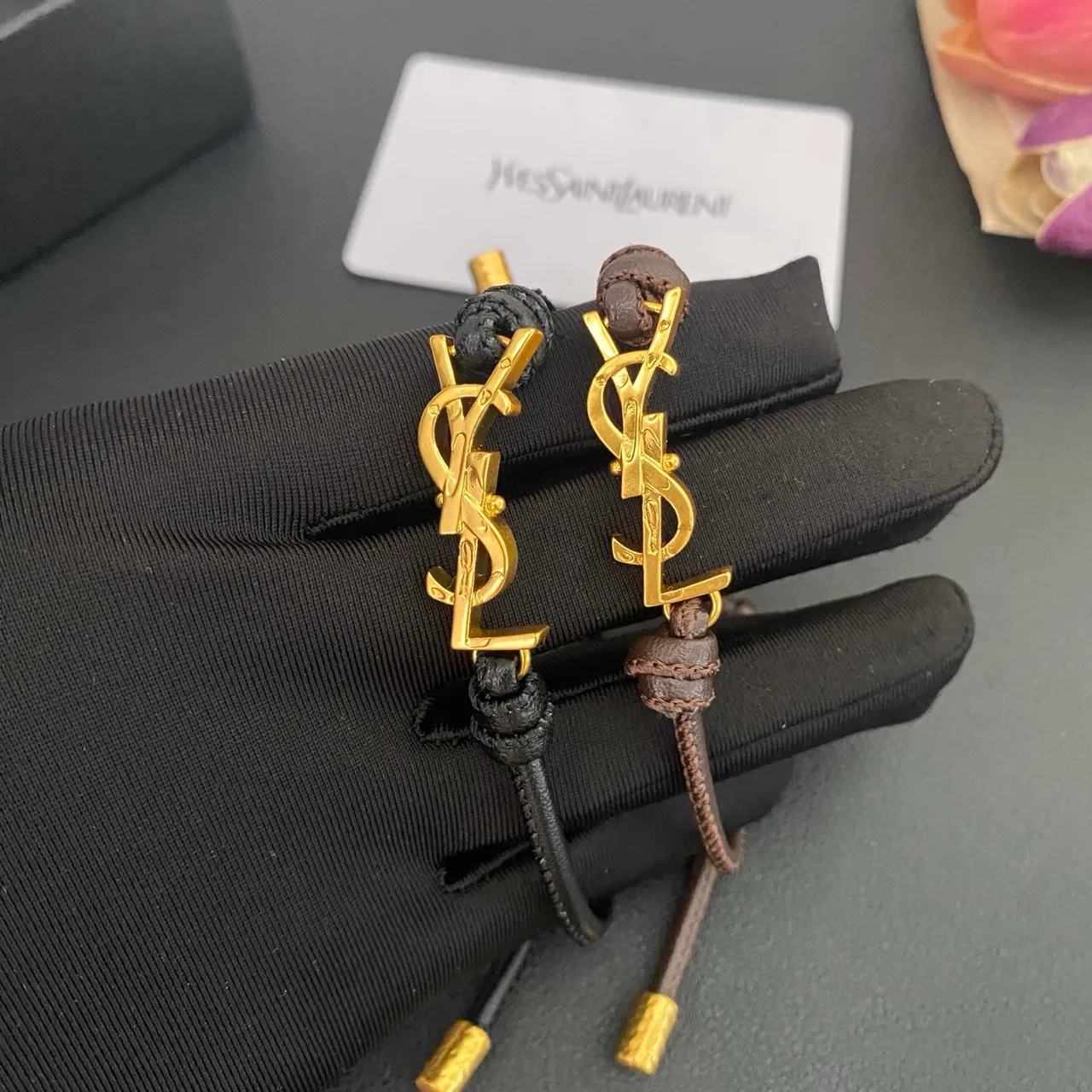 Saint Laurent YSL Monogram Black Brown Interlocking Charm Adjustable Cord Construction Bracelet 4