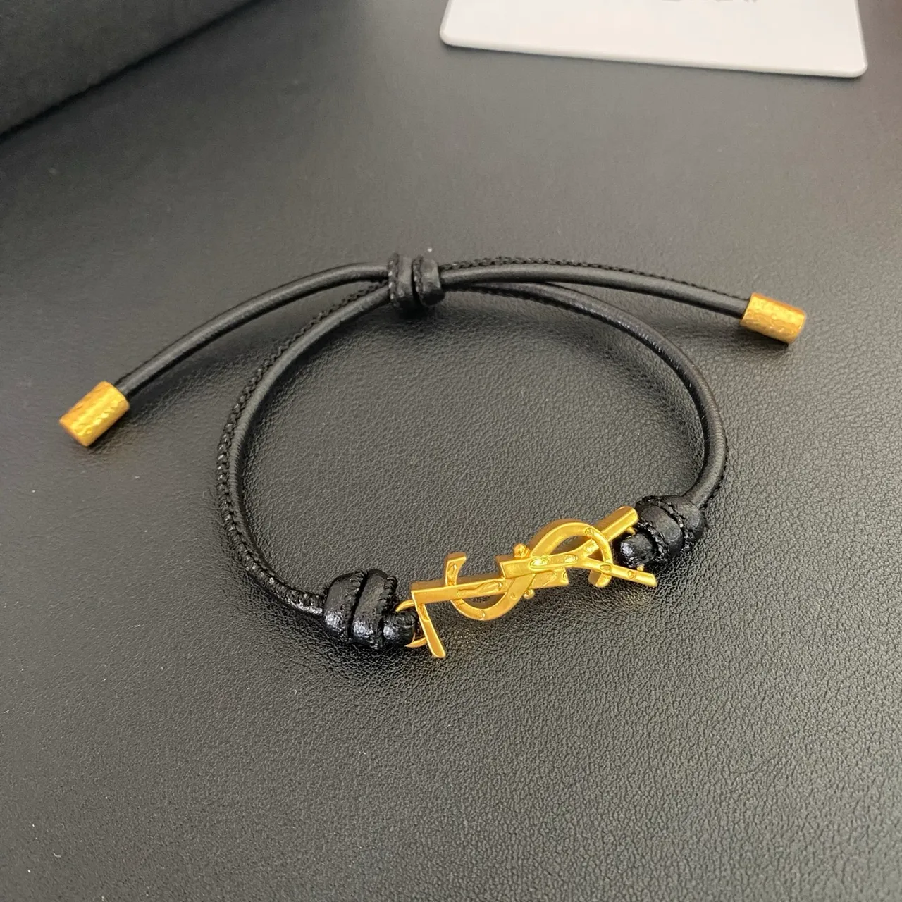 Saint Laurent YSL Monogram Black Brown Interlocking Charm Adjustable Cord Construction Bracelet 6