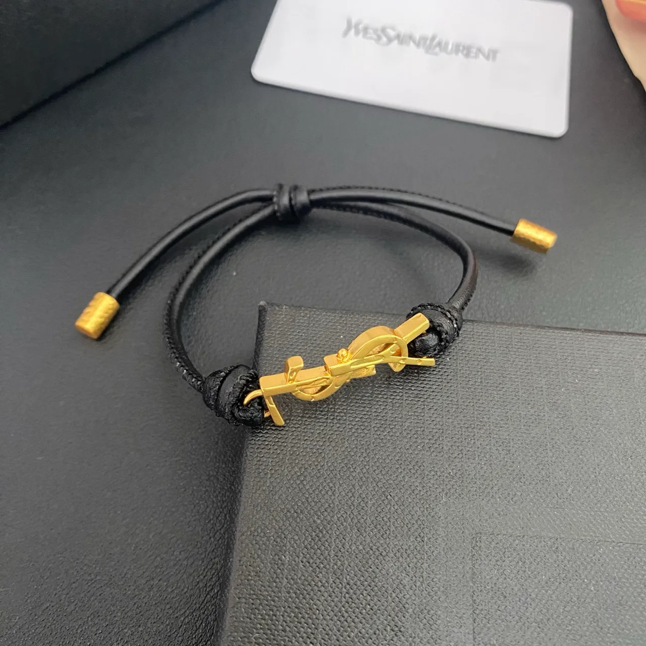 Saint Laurent YSL Monogram Black Brown Interlocking Charm Adjustable Cord Construction Bracelet 8