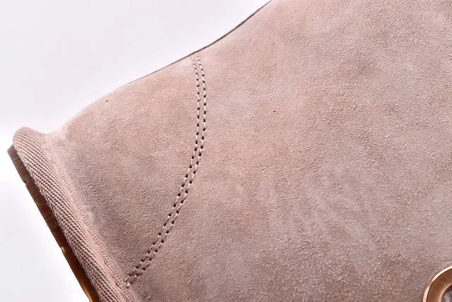 UGG মিনি বেলি বো বেইজ স্যুয়েড এনকেল বুটস 6