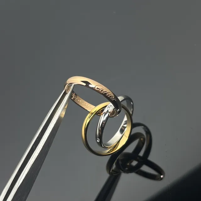 خاتم Cartier Trinity Triple Band ذهبي وأسود بمينا 5