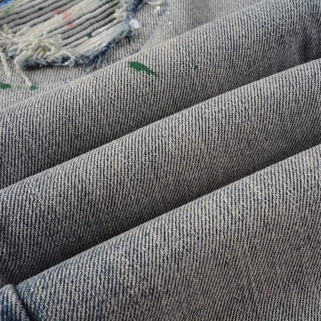 Distressed Paint-Splattered Slim-Fit Light Wash Jeans 8