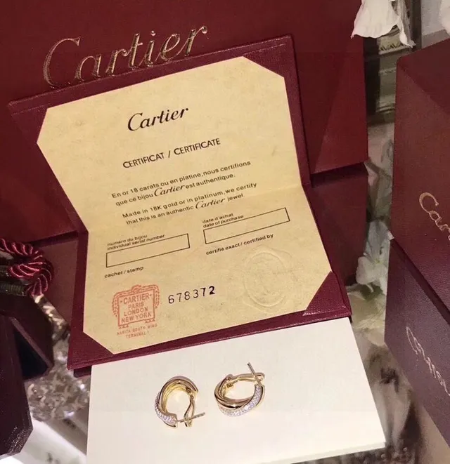 Boucles d'oreilles dorées blanches entrelacées à triple bande avec accent de pierres pavées 6