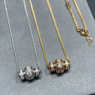 Collier argent et or pendentif cylindrique empilable pavé-set de pierres transparentes