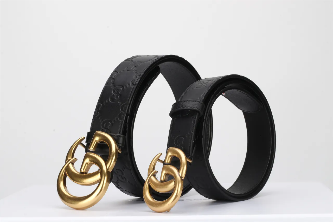 Gucci Double G cinturón negro dorado embossado GG Monogram Polished Buckle de cuero 4