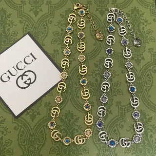 Collier Gucci Ophidia Or et Argent avec maillons GG entrelacés et motifs floraux de marguerite