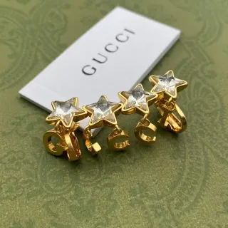 Gucci Brincos Clip-On Estrela de Cristal em Tons Dourados