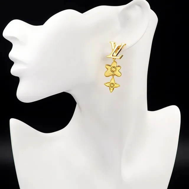 Boucles d'oreilles Louis Vuitton en métal doré asymétriques pendantes 8
