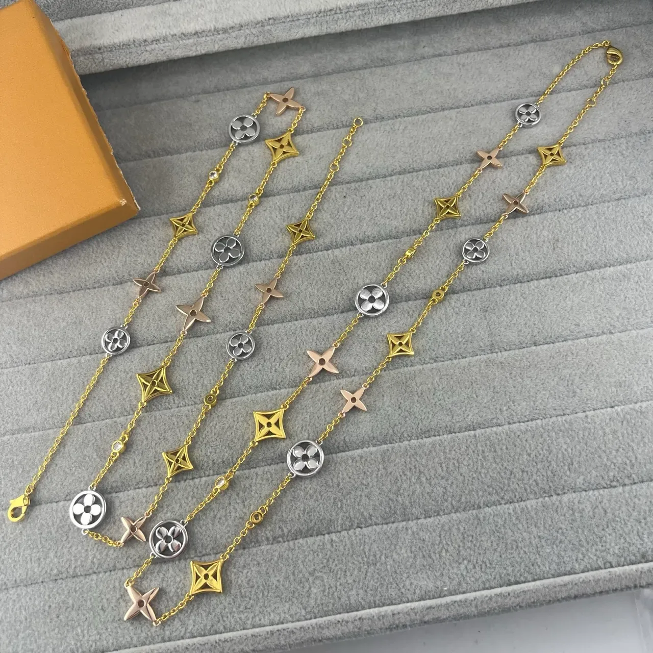 Louis Vuitton Multi-Charm Gold-Tone Floral and Star Bracelet 4
