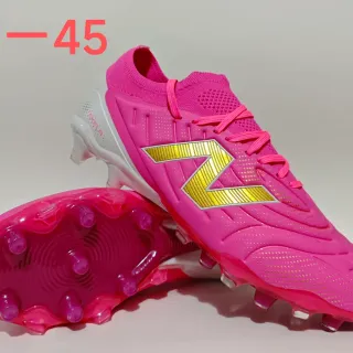 New Balance Tekela Tênis de futebol para gramado firme rosa dourado gola de meia tricô cadarços assimétricos