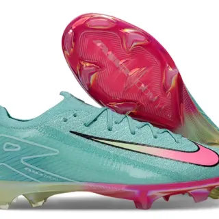 Nike Chaussures de football bleu et rose avec upper en knit lacets asymétriques pour terrain ferme