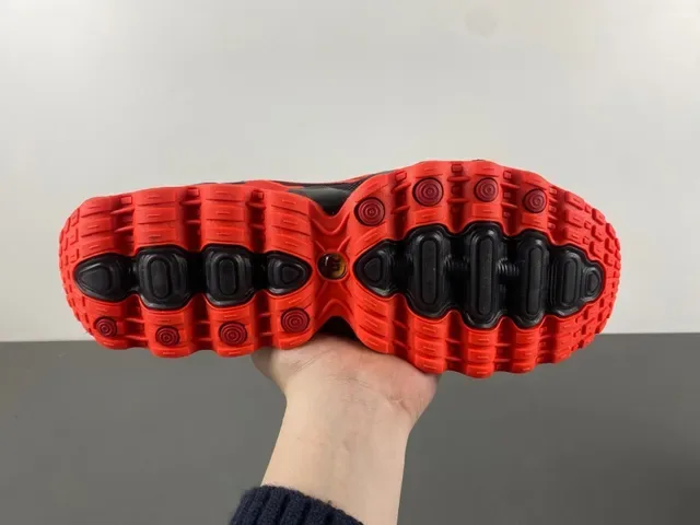 Nike Chaussure Performance Orange et Noir avec Semelle Intermédiaire Pod 9