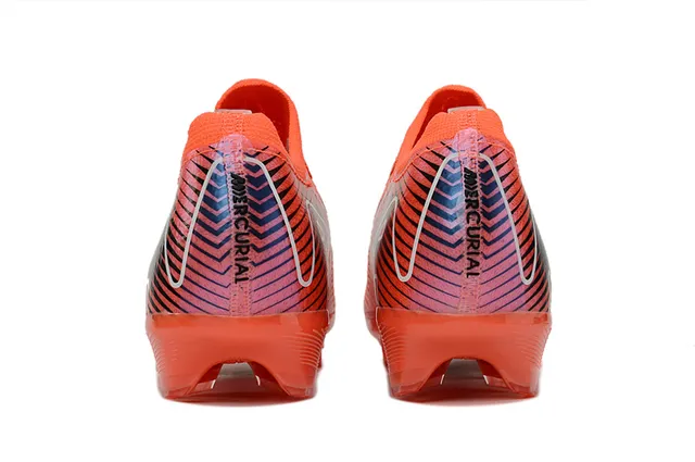 Nike Zapatillas de fútbol de corte bajo con empeine de punto sistema de cordones asimétrico para terreno firme color naranja rosa 4