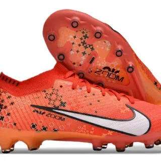 Nike Chuteiras de futebol laranja e branco com upper de malha overlay com padrão Firm-Ground