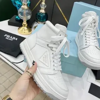 Prada Cloudbust सफेद चमड़े की हाई-टॉप लाइफस्टाइल स्नीकर