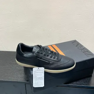 Zegna काला पेबल्ड चमड़ा लो टॉप लाइफस्टाइल स्नीकर
